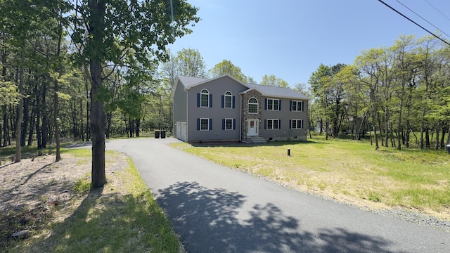 2292 Bismark Rd, Blakeslee, PA 18610 - colonial-style house with asphalt driveway and a front lawn