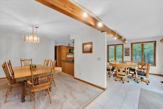 96 Wolf Hollow Rd, Lake Harmony, PA 18624 - dining space with baseboards, a textured ceiling, light tile patterned floors, and a chandelier