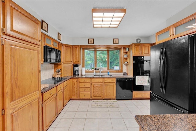 96 Wolf Hollow Rd, Lake Harmony, PA 18624 - kitchen with black appliances, a sink, light tile patterned floors, backsplash, and glass insert cabinets