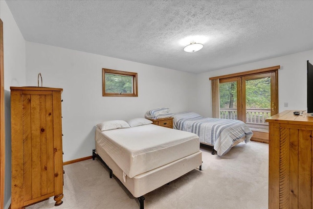 96 Wolf Hollow Rd, Lake Harmony, PA 18624 - bedroom with light carpet, a textured ceiling, and baseboards