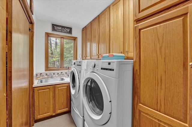 96 Wolf Hollow Rd, Lake Harmony, PA 18624 - laundry area with washer and clothes dryer, cabinet space, and a textured ceiling