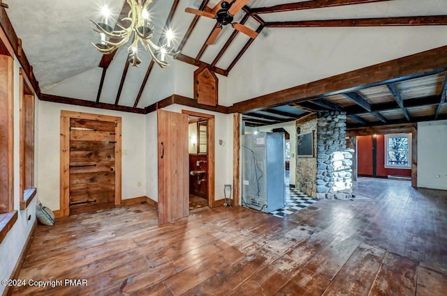 unfurnished living room featuring lofted ceiling with beams, hardwood / wood-style floors, and ceiling fan with notable chandelier