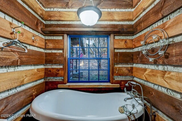 full bath featuring a soaking tub