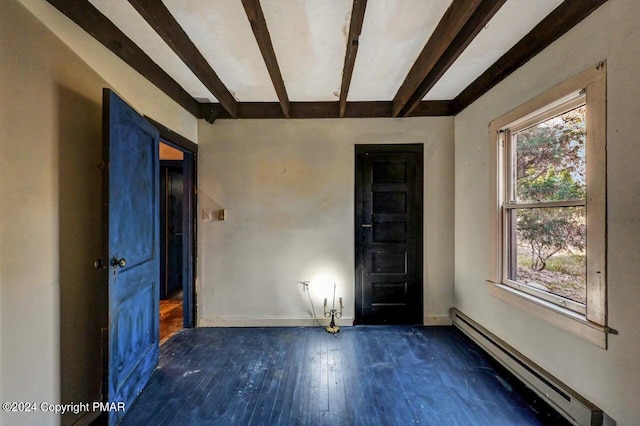 empty room with beam ceiling, wood-type flooring, baseboards, and baseboard heating