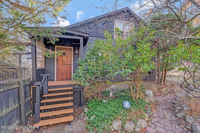 doorway to property with fence