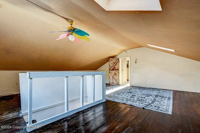 bonus room with lofted ceiling, hardwood / wood-style flooring, and a ceiling fan