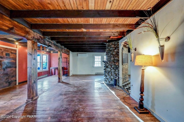 below grade area with baseboard heating, wood finished floors, and wood ceiling