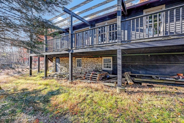 rear view of house with a wooden deck