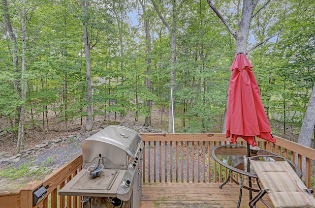 wooden terrace featuring grilling area