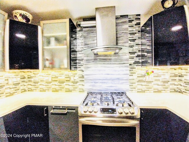 kitchen featuring tasteful backsplash, stainless steel range with gas stovetop, and ventilation hood