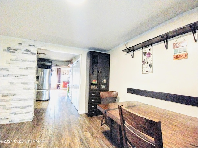 dining room with hardwood / wood-style floors