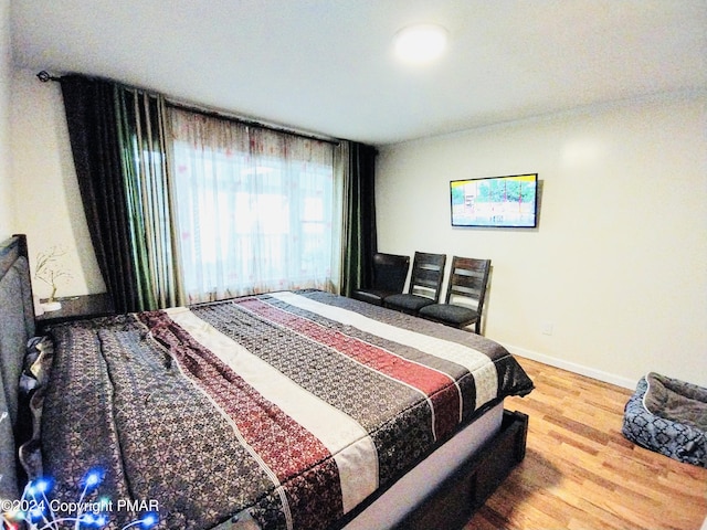 bedroom featuring hardwood / wood-style flooring