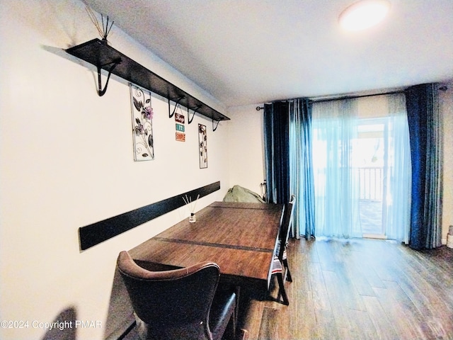 dining room with hardwood / wood-style flooring