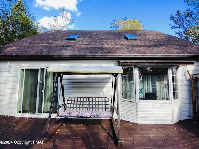 rear view of property with a deck