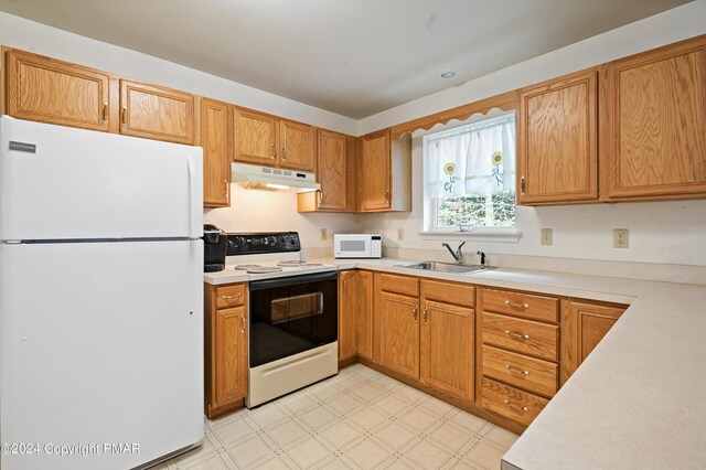 kitchen with sink and white appliances