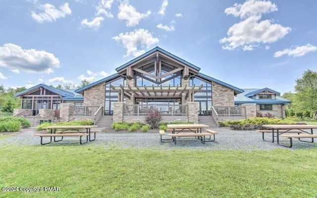 surrounding community with a pergola and a lawn