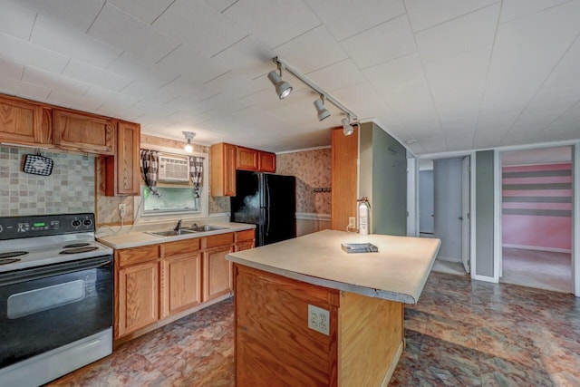 159 Sandstone Dr, Dingmans Ferry, PA 18328 - kitchen with range with electric stovetop, freestanding refrigerator, a sink, track lighting, and light countertops