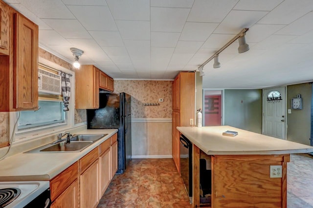 159 Sandstone Dr, Dingmans Ferry, PA 18328 - kitchen with range with electric cooktop, track lighting, light countertops, wainscoting, and a sink