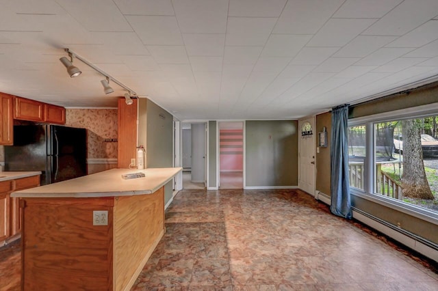 159 Sandstone Dr, Dingmans Ferry, PA 18328 - kitchen with freestanding refrigerator, track lighting, light countertops, and a peninsula