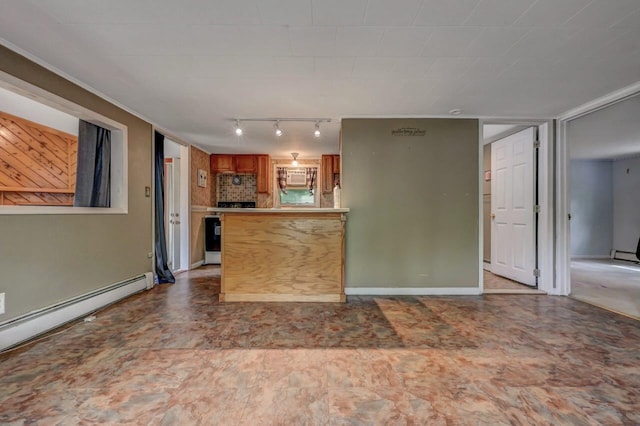 159 Sandstone Dr, Dingmans Ferry, PA 18328 - kitchen with brown cabinets, rail lighting, a baseboard heating unit, a peninsula, and decorative backsplash