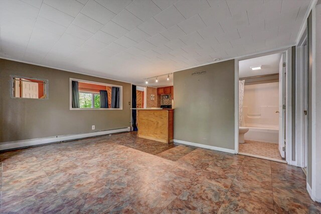 159 Sandstone Dr, Dingmans Ferry, PA 18328 - unfurnished living room featuring rail lighting and baseboard heating