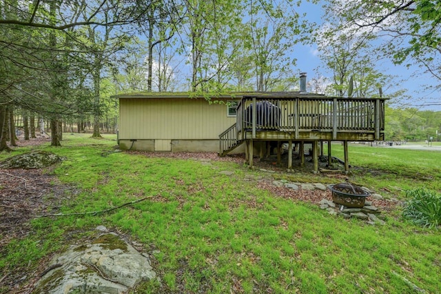 159 Sandstone Dr, Dingmans Ferry, PA 18328 - rear view of property featuring a fire pit, a deck, crawl space, stairs, and a yard