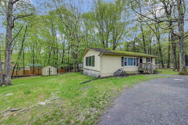 159 Sandstone Dr, Dingmans Ferry, PA 18328 - view of side of home featuring a storage shed and an outdoor structure