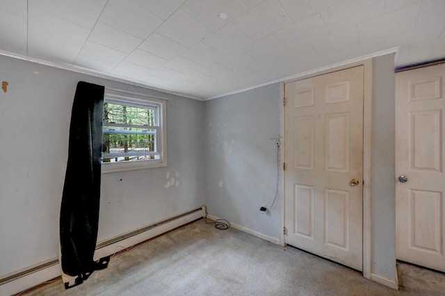 159 Sandstone Dr, Dingmans Ferry, PA 18328 - spare room featuring a baseboard heating unit, carpet, ornamental molding, and baseboards