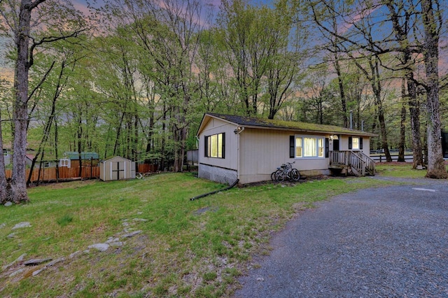 159 Sandstone Dr, Dingmans Ferry, PA 18328 - view of side of property featuring a storage unit and an outdoor structure