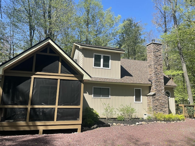 1515 Beech Spring Dr, Pocono Pines, PA 18350 - view of side of home featuring a sunroom, roof with shingles, and a chimney