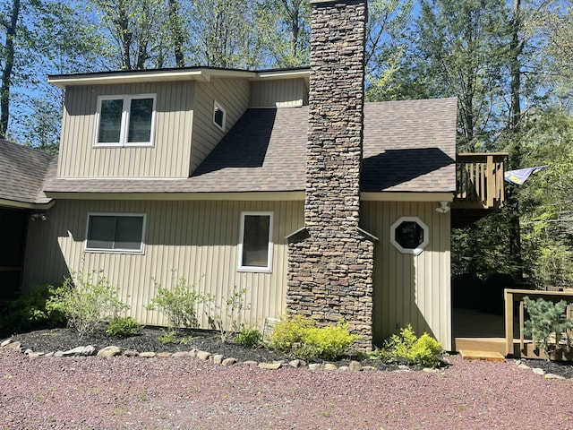 1515 Beech Spring Dr, Pocono Pines, PA 18350 - view of side of home with a shingled roof and a chimney