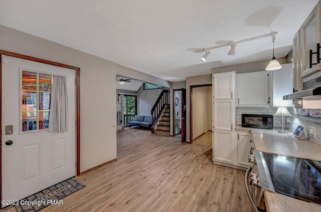 1148 Country Place Dr, Tobyhanna, PA 18466 - kitchen with electric stove, white cabinetry, light wood finished floors, and light countertops
