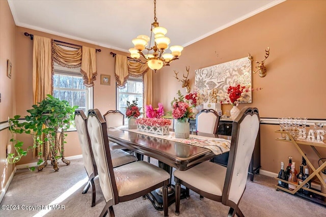 carpeted dining space featuring ornamental molding, a chandelier, and baseboards