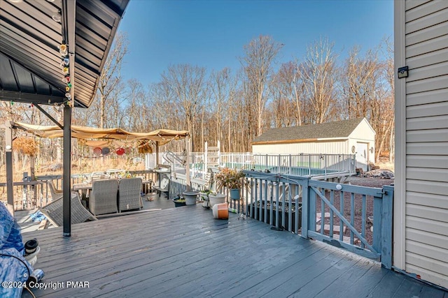 wooden terrace with an outdoor structure