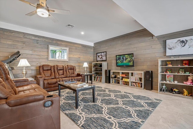 115 Ridgewood Ln, Hawley, PA 18428 - tiled living area featuring wood walls and ceiling fan