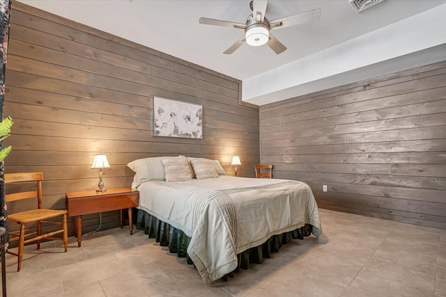 115 Ridgewood Ln, Hawley, PA 18428 - bedroom featuring wood walls, light tile patterned floors, and ceiling fan