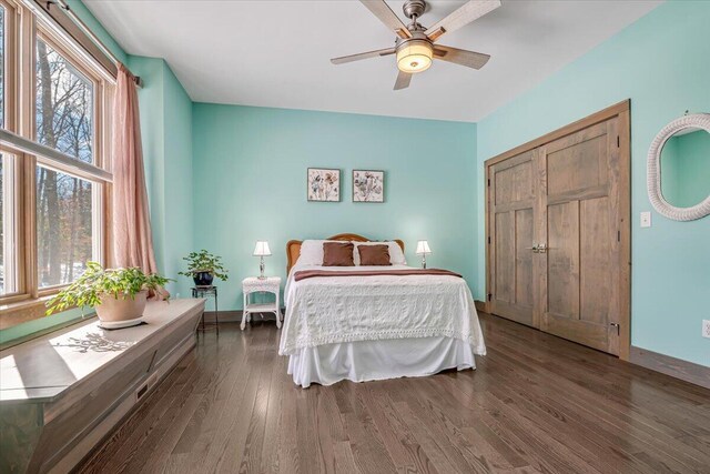 115 Ridgewood Ln, Hawley, PA 18428 - bedroom with multiple windows, wood finished floors, baseboards, and ceiling fan