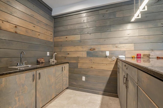 115 Ridgewood Ln, Hawley, PA 18428 - bar area featuring a sink, wooden walls, and light tile patterned flooring