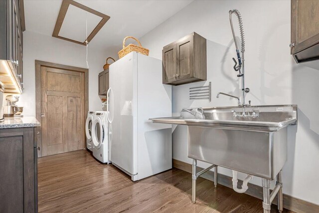 115 Ridgewood Ln, Hawley, PA 18428 - washroom featuring cabinet space, washer and clothes dryer, wood finished floors, and attic access