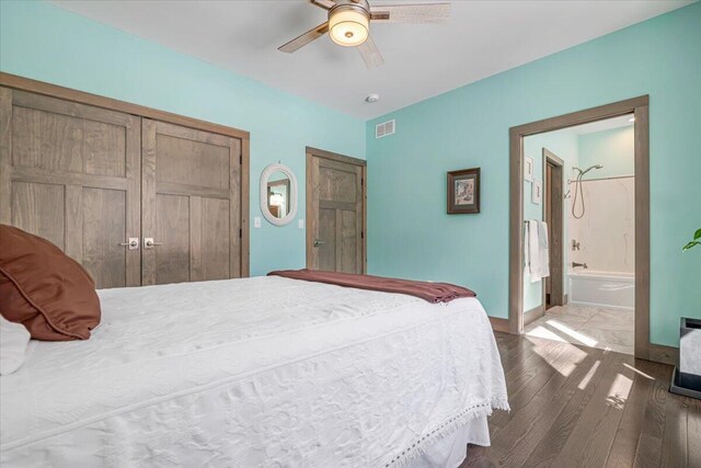 115 Ridgewood Ln, Hawley, PA 18428 - bedroom with wood finished floors, a closet, a ceiling fan, ensuite bath, and baseboards