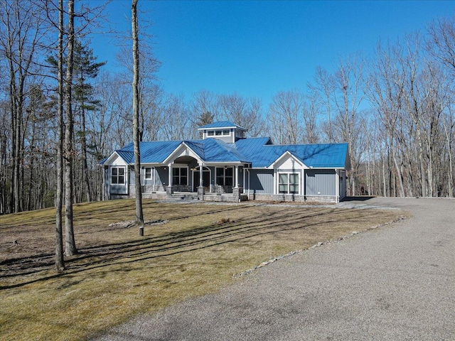 115 Ridgewood Ln, Hawley, PA 18428 - view of front of property with covered porch, metal roof, and a front lawn