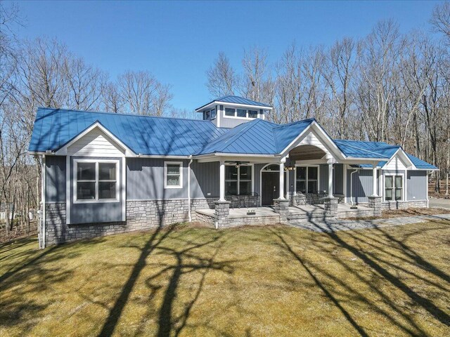 115 Ridgewood Ln, Hawley, PA 18428 - rear view of property featuring metal roof, a ceiling fan, covered porch, and a lawn