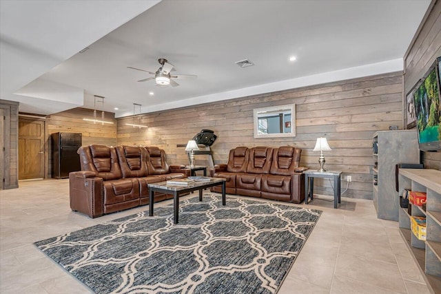 115 Ridgewood Ln, Hawley, PA 18428 - living area featuring wooden walls, ceiling fan, recessed lighting, and light tile patterned flooring