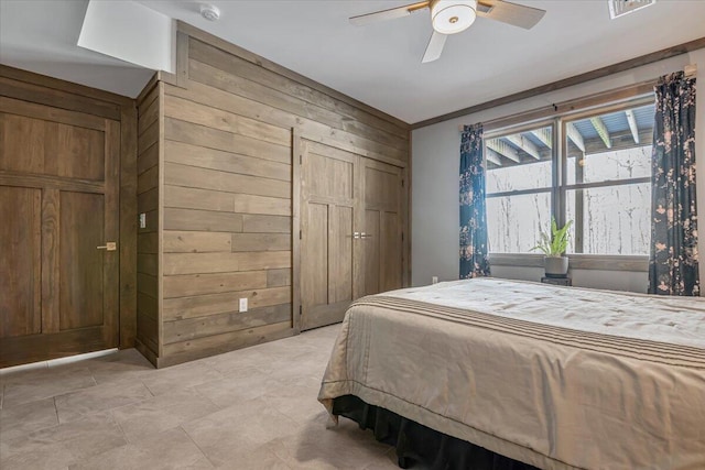 115 Ridgewood Ln, Hawley, PA 18428 - bedroom featuring wood walls, a closet, lofted ceiling, and ceiling fan