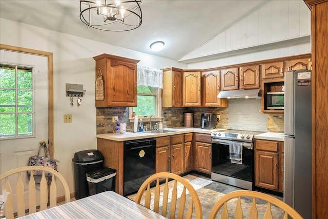 105 Beaver Ln, East Stroudsburg, PA 18301 - kitchen featuring stainless steel appliances, under cabinet range hood, vaulted ceiling, a sink, and plenty of natural light
