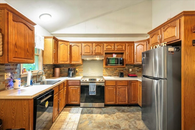105 Beaver Ln, East Stroudsburg, PA 18301 - kitchen with stainless steel appliances, a sink, vaulted ceiling, under cabinet range hood, and brown cabinets