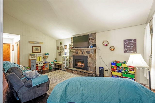105 Beaver Ln, East Stroudsburg, PA 18301 - living area featuring lofted ceiling, a stone fireplace, and wood finished floors