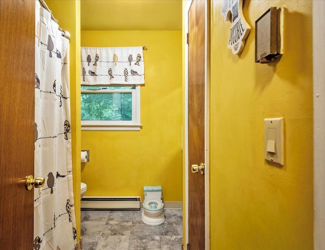 105 Beaver Ln, East Stroudsburg, PA 18301 - full bathroom featuring baseboard heating, toilet, baseboards, and stone finish flooring