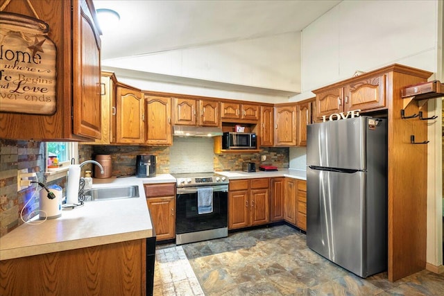 105 Beaver Ln, East Stroudsburg, PA 18301 - kitchen featuring stainless steel appliances, a sink, brown cabinets, range hood, and light countertops
