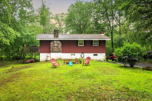 105 Beaver Ln, East Stroudsburg, PA 18301 - back of house with a chimney, a lawn, and crawl space
